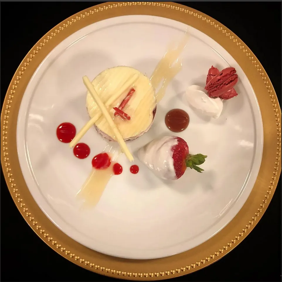 Plated dessert with strawberries and cream